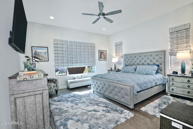 bedroom featuring dark hardwood / wood-style flooring and ceiling fan