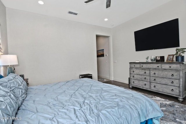 bedroom featuring ceiling fan and dark hardwood / wood-style floors