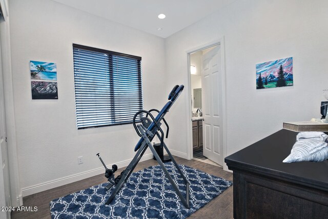 workout room with dark hardwood / wood-style flooring