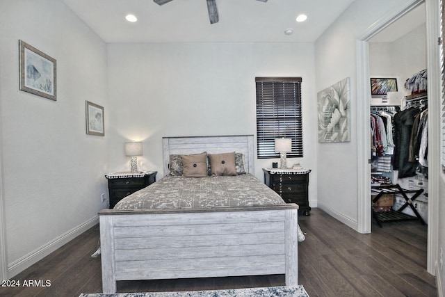 bedroom with ceiling fan, dark wood-type flooring, and a closet