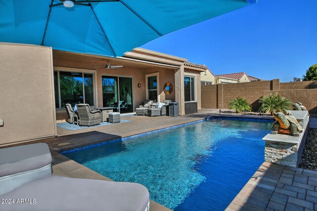 view of pool featuring ceiling fan, a patio area, and an outdoor hangout area