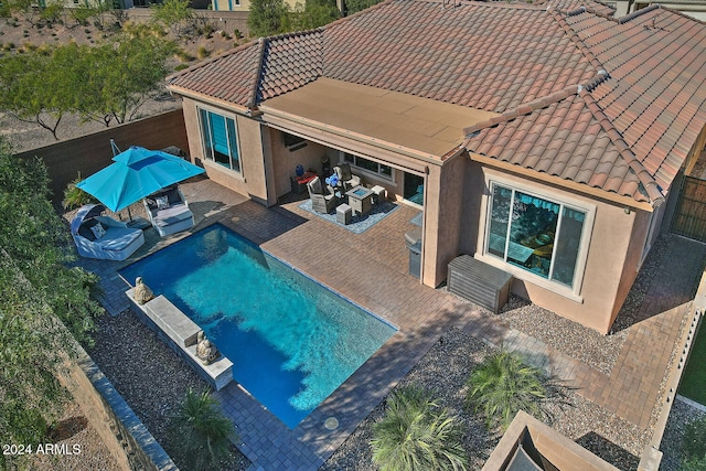 view of pool with a patio area and an outdoor hangout area