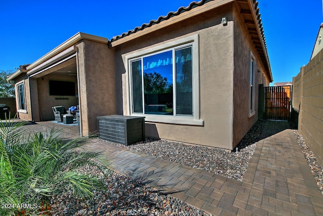 view of side of property with a patio