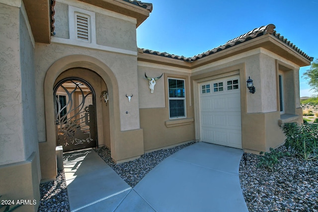 property entrance featuring a garage