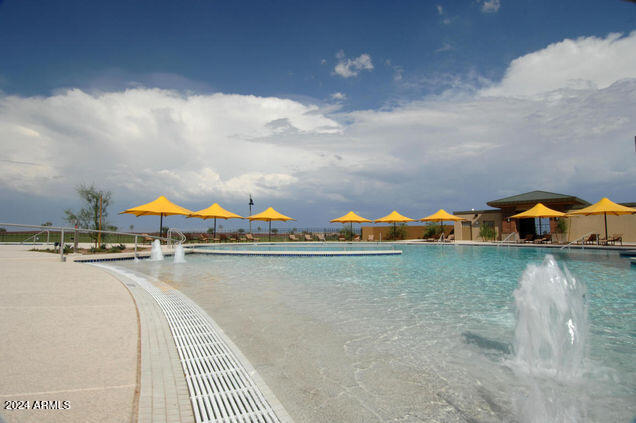 view of pool with pool water feature