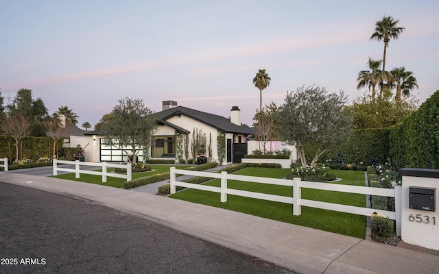 modern home featuring a lawn