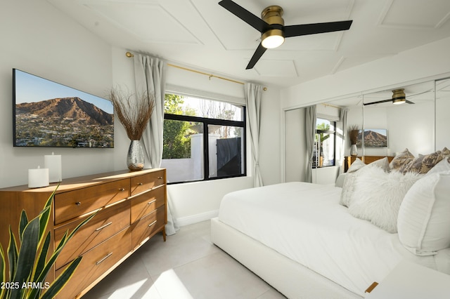 tiled bedroom with ceiling fan