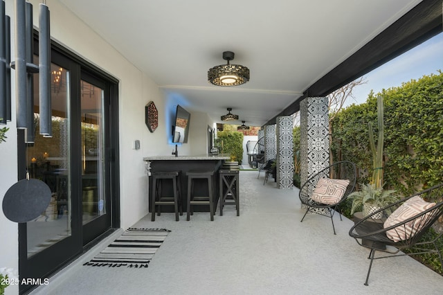 view of patio / terrace featuring an outdoor bar