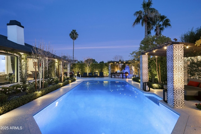 pool at dusk with a patio