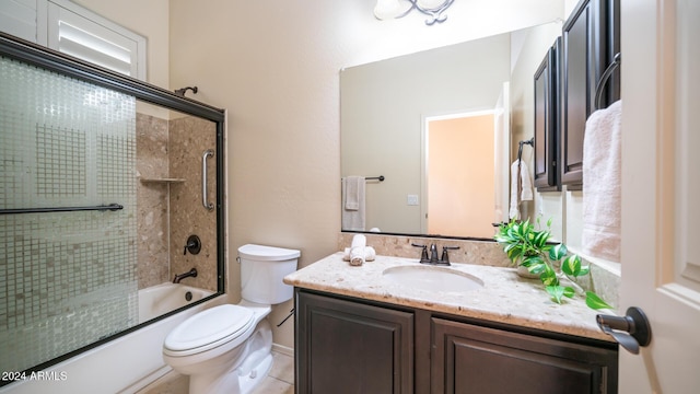 full bathroom featuring vanity, toilet, and enclosed tub / shower combo