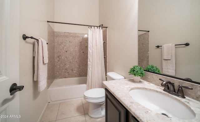 full bathroom featuring tile patterned floors, shower / tub combo with curtain, vanity, and toilet