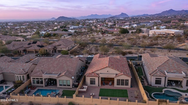 aerial view at dusk with a mountain view