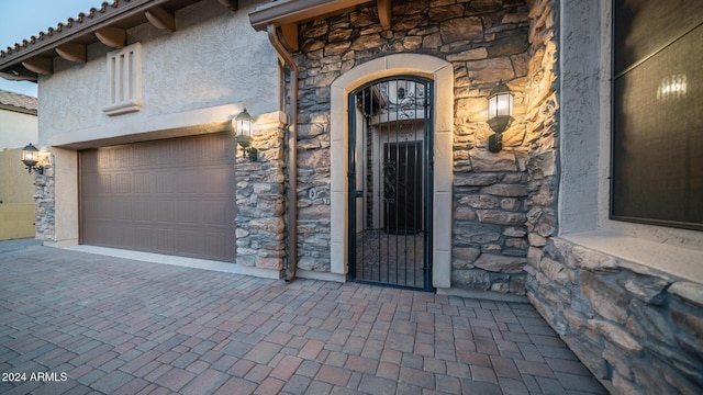 entrance to property featuring a garage