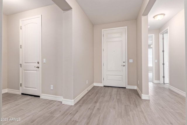 foyer entrance with light wood-type flooring