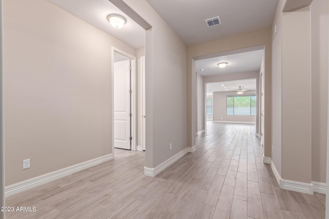 hallway featuring light wood-type flooring