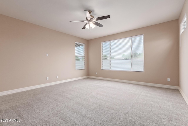 carpeted empty room with ceiling fan