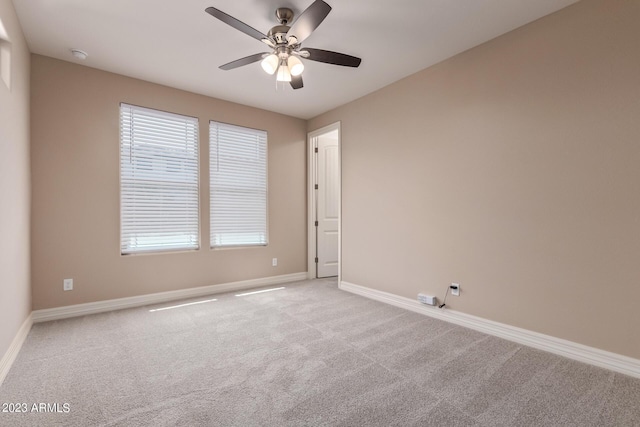 empty room featuring carpet and ceiling fan