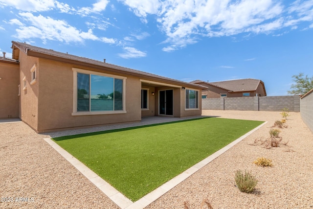 back of house featuring a patio