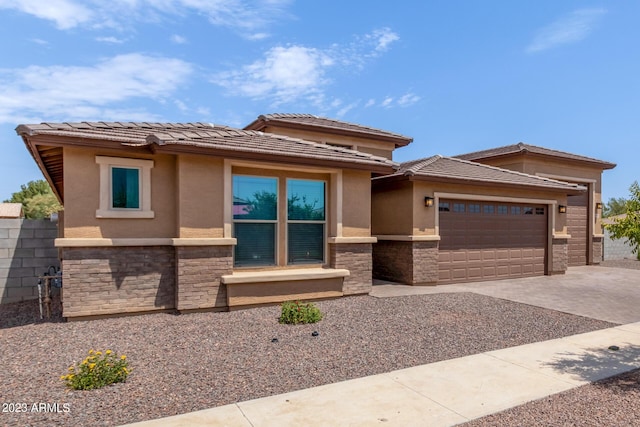 prairie-style home featuring a garage