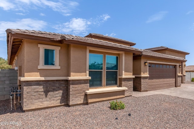 prairie-style house featuring a garage