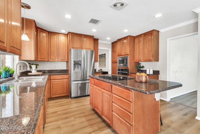 737 E 7th Pl, Mesa, AZ 85203 - kitchen featuring stainless steel appliances, a sink, crown molding, a breakfast bar area, and a center island