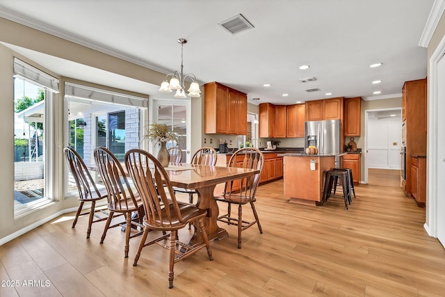 737 E 7th Pl, Mesa, AZ 85203 - dining space with crown molding, a chandelier, light wood-type flooring, recessed lighting, and baseboards