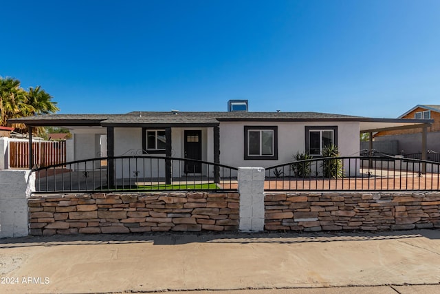 view of front of home with a carport