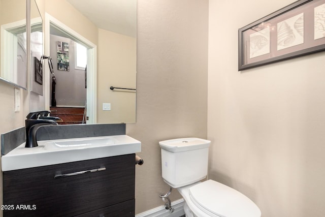 5612 S 21st Pl, Phoenix, AZ 85040 - bathroom featuring toilet, vanity, and baseboards