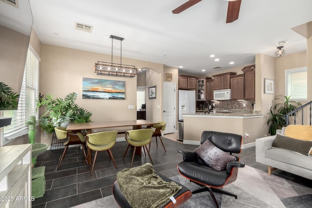 5612 S 21st Pl, Phoenix, AZ 85040 - living room featuring a ceiling fan, arched walkways, and recessed lighting