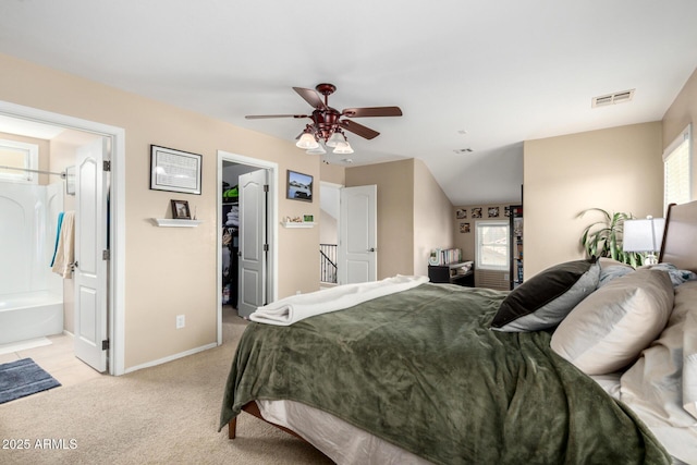5612 S 21st Pl, Phoenix, AZ 85040 - bedroom with a walk in closet, light carpet, baseboards, ceiling fan, and a closet