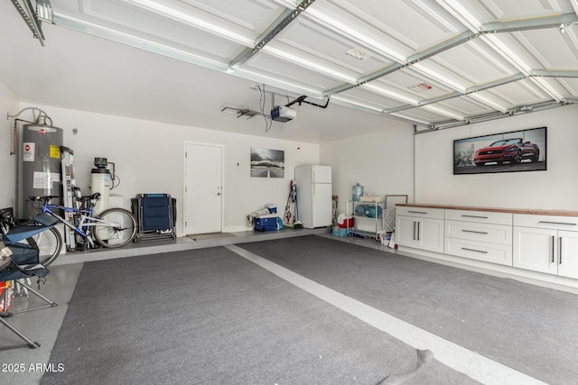 5612 S 21st Pl, Phoenix, AZ 85040 - garage featuring freestanding refrigerator, electric water heater, and a garage door opener