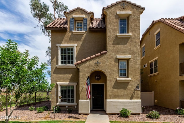 5612 S 21st Pl, Phoenix, AZ 85040 - mediterranean / spanish house featuring a tile roof and stucco siding