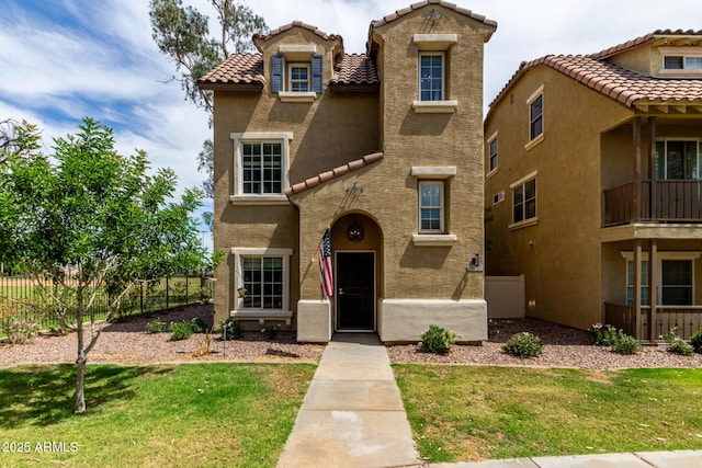 5612 S 21st Pl, Phoenix, AZ 85040 - mediterranean / spanish-style home featuring a tiled roof and stucco siding