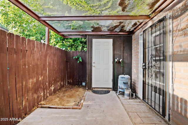 exterior space featuring a patio area and fence