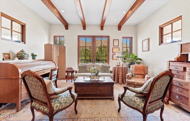 living area with french doors and beamed ceiling