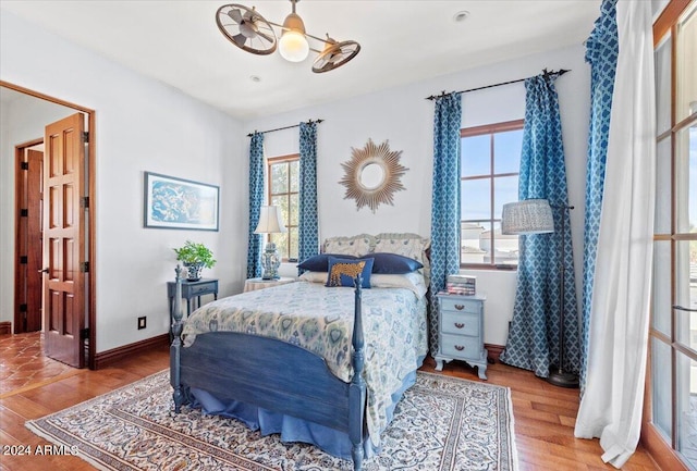 bedroom featuring ceiling fan and wood-type flooring