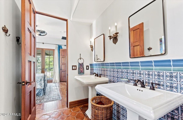 bathroom featuring tile patterned flooring and dual sinks