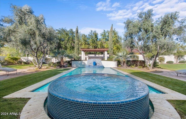 view of pool featuring an in ground hot tub and a lawn