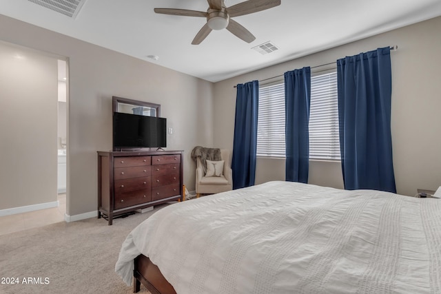 bedroom featuring ceiling fan and light carpet