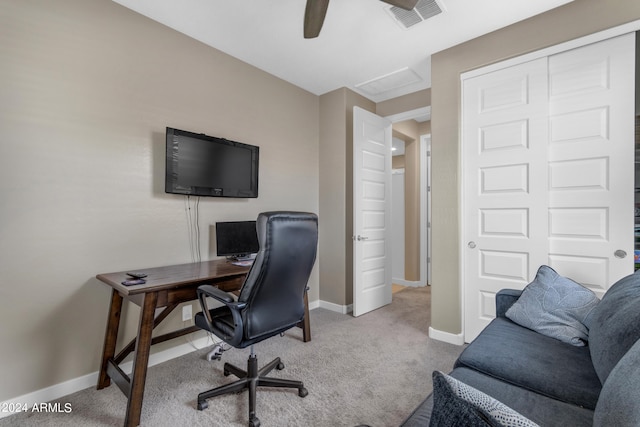 carpeted office with ceiling fan