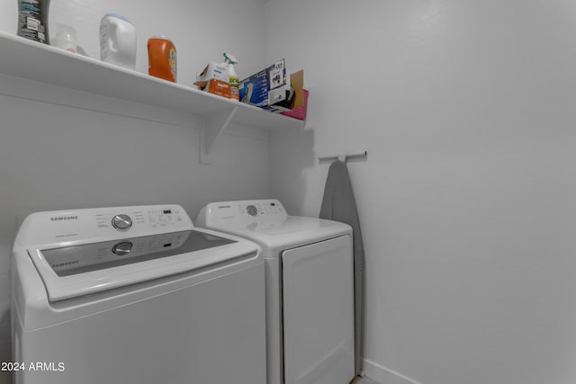 washroom featuring independent washer and dryer