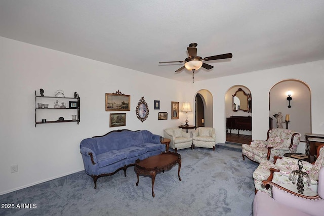 7537 W Bluefield Ave, Glendale, AZ 85308 - carpeted living room with arched walkways and a ceiling fan
