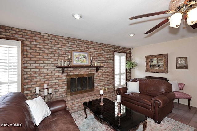 7537 W Bluefield Ave, Glendale, AZ 85308 - living area with plenty of natural light, ceiling fan, brick wall, a fireplace, and baseboards