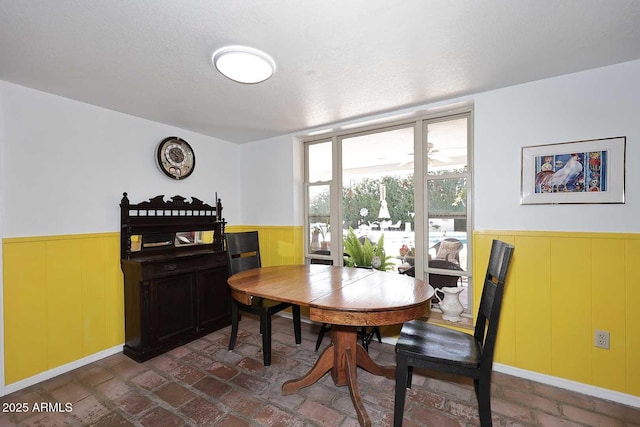 7537 W Bluefield Ave, Glendale, AZ 85308 - dining room featuring wainscoting and brick flooring