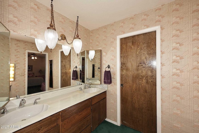 7537 W Bluefield Ave, Glendale, AZ 85308 - ensuite bathroom featuring double vanity and wallpapered walls