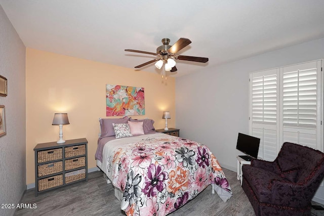 7537 W Bluefield Ave, Glendale, AZ 85308 - bedroom featuring a ceiling fan, wood finished floors, and baseboards