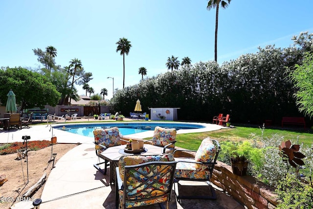 7537 W Bluefield Ave, Glendale, AZ 85308 - view of swimming pool featuring a patio area, a fenced backyard, and outdoor dining area