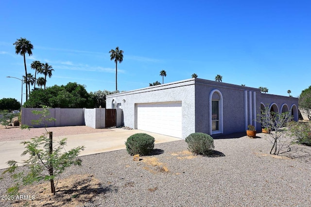 7537 W Bluefield Ave, Glendale, AZ 85308 - view of front of house with driveway, stucco siding, and a garage