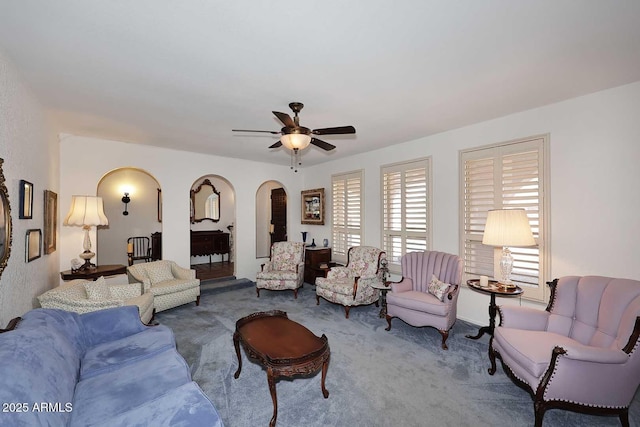 7537 W Bluefield Ave, Glendale, AZ 85308 - living room with arched walkways, carpet floors, and a ceiling fan