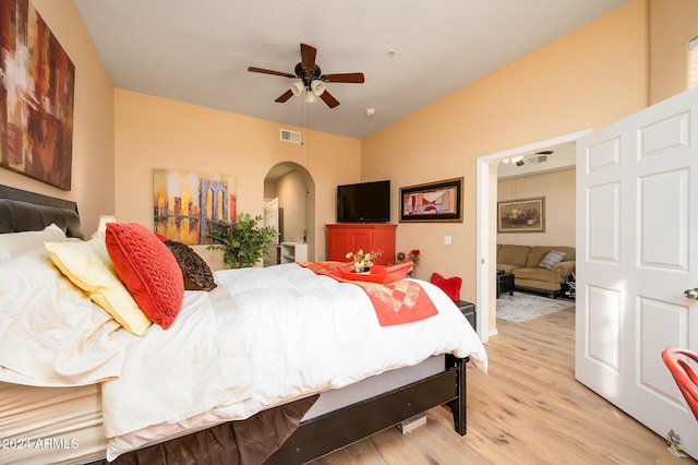 bedroom with light hardwood / wood-style floors and ceiling fan